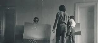 Paintings by Gerhard Richter being moved by student assistants in preparation for Strategy: Get Arts. Photo