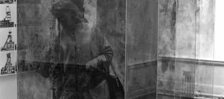 The art critic Cordelia Oliver among glass containers by Erich Reusch and photographs by Bernd and Hilla Becher in studio E.25