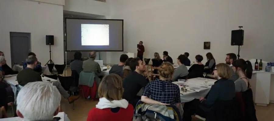 Christopher Griffin speaking at Café des Artistes.