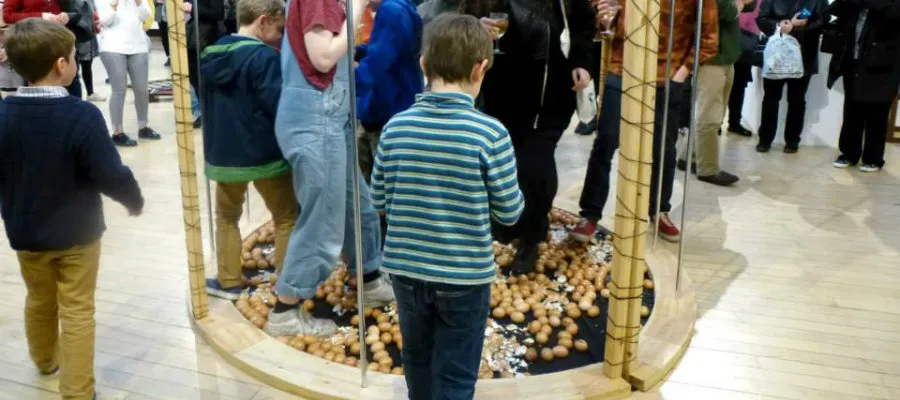 Children interact with artwork at the Confessional Art Exhibition