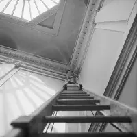 Blinky Palermo making his wall painting Blue/Yellow/White/Red (August 1970). Photo