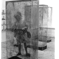The art critic Cordelia Oliver among glass containers by Erich Reusch and photographs by Bernd and Hilla Becher in studio E.25. 
