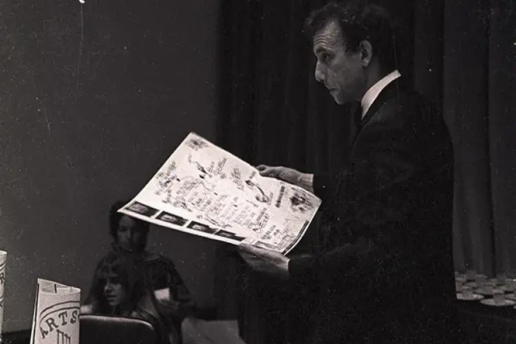 Daniel Spoerri reading from his menu for The Banana Trap Dinner in C.26, the old Boardroom of ECA (23 August 1970). Photo
