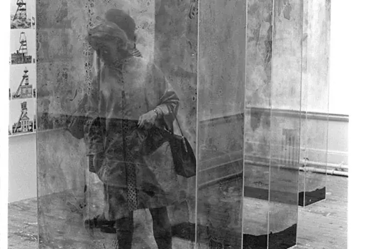 The art critic Cordelia Oliver among glass containers by Erich Reusch and photographs by Bernd and Hilla Becher in studio E.25. 